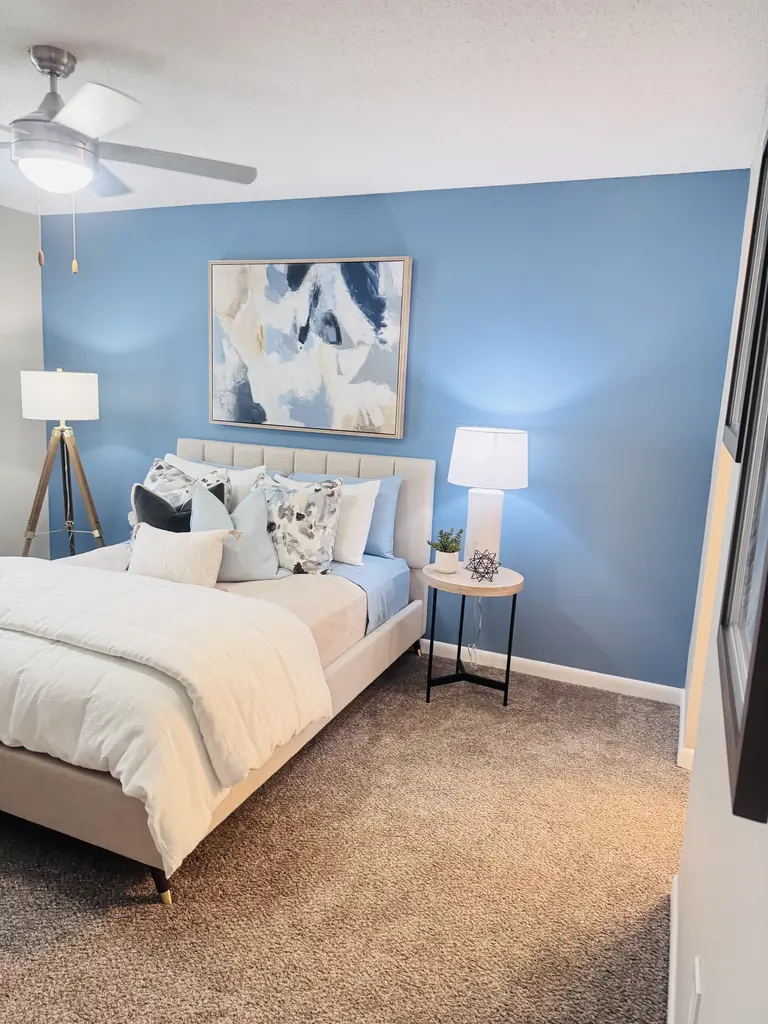 Bedroom with a blue accent wall