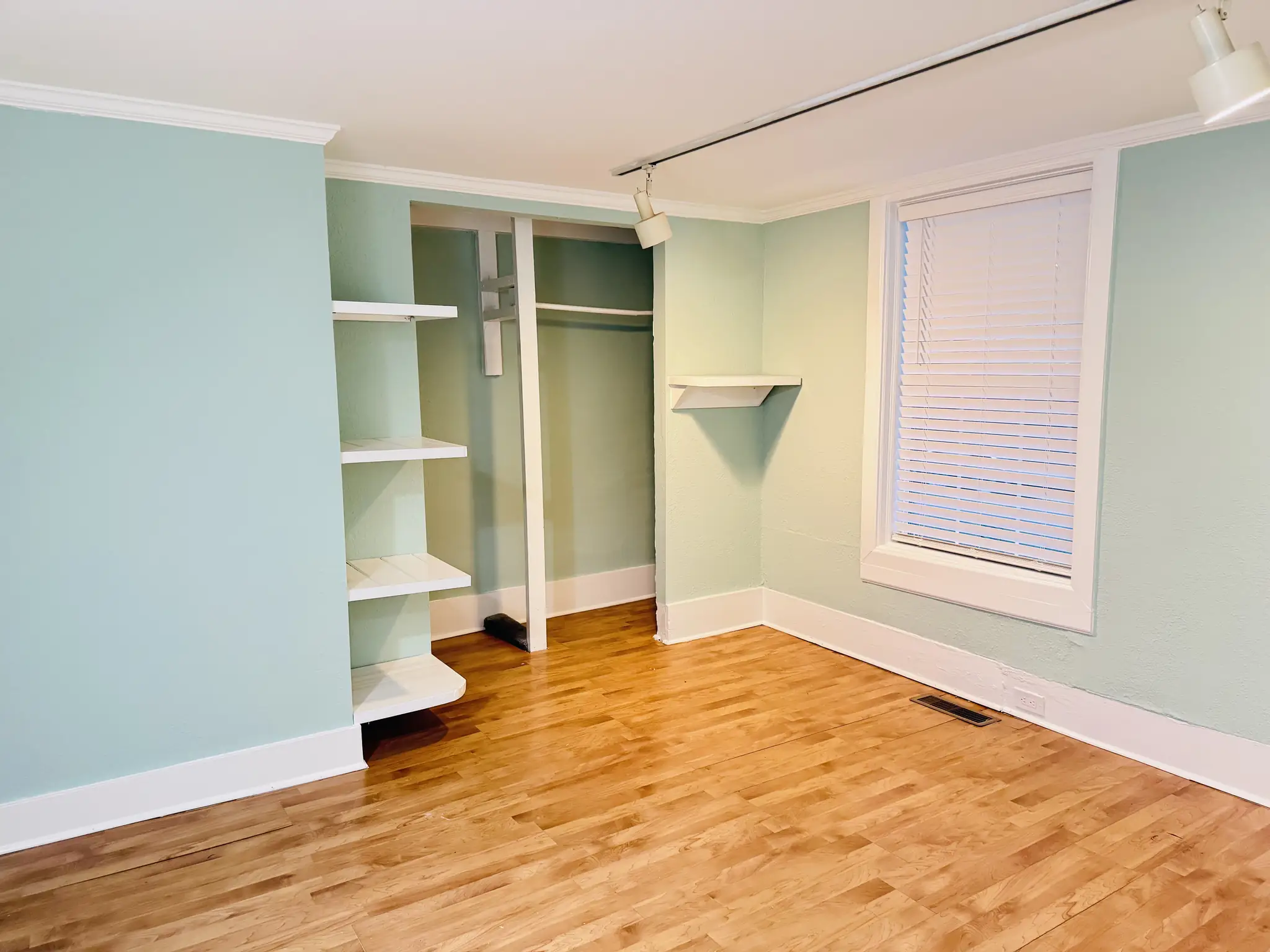 Room painted mint green with white trim